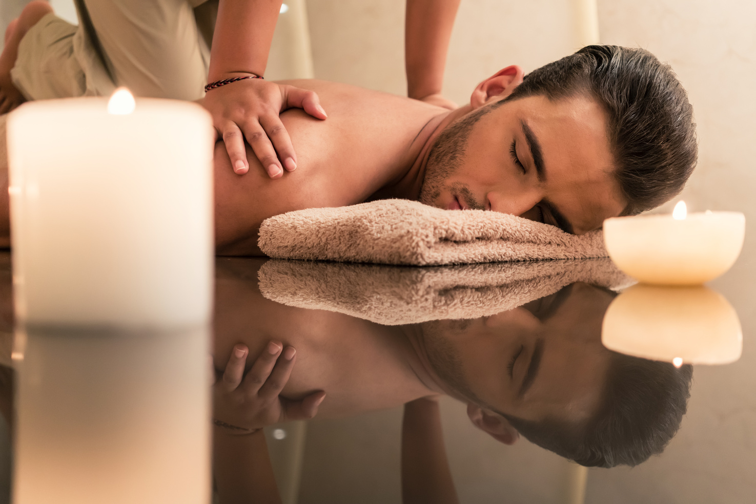 Young Man Enjoying the Healing Benefits of Traditional Thai Massage